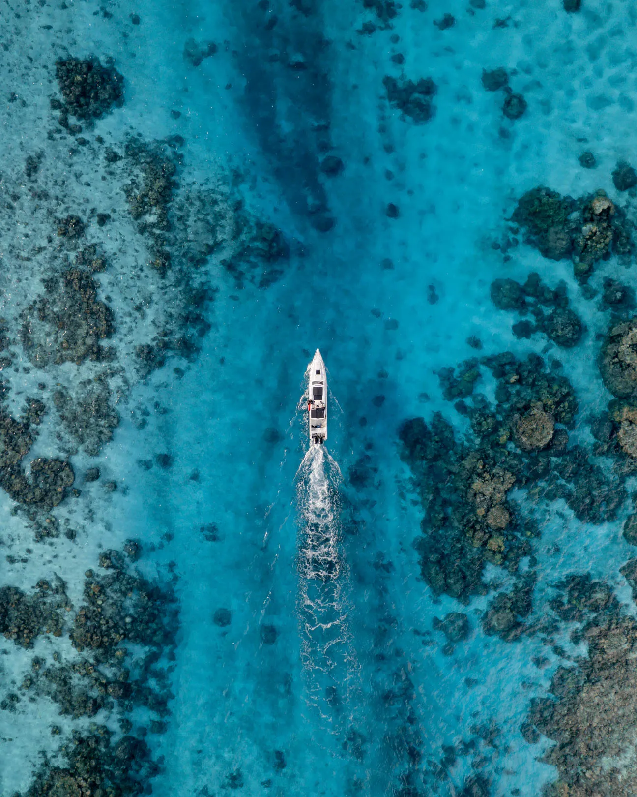 Coral-filled channel with crystal-clear water in the Ayau Archipelago