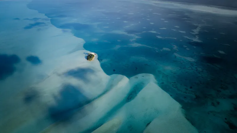 Aerial view of a tiny island and sandbanks in the Ayau atoll, Raja Ampat
