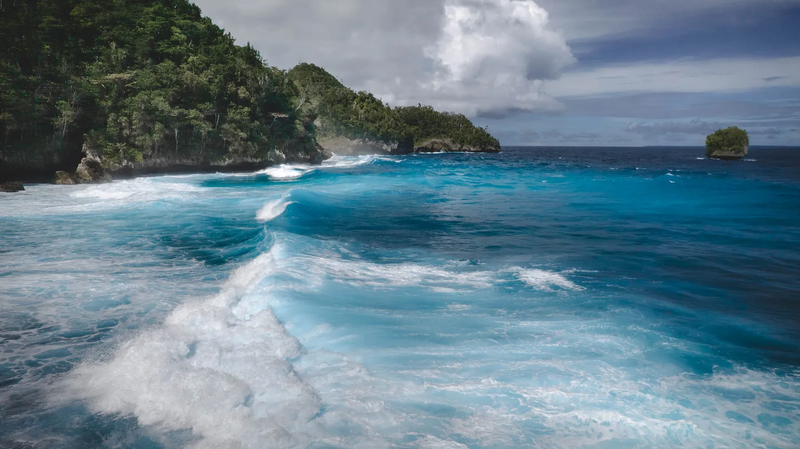 Waves breaking along remote North Waigeo, Raja Ampat