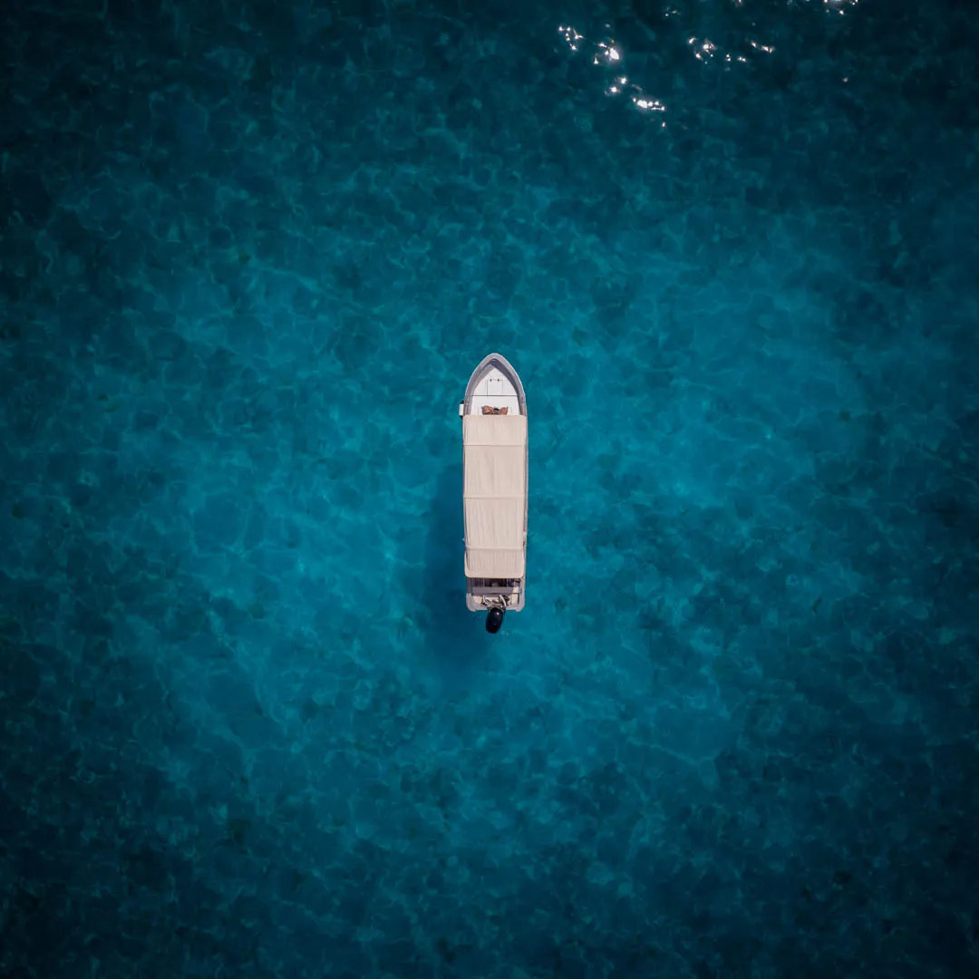 Private speedboat in Raja Ampat's crystal clear waters