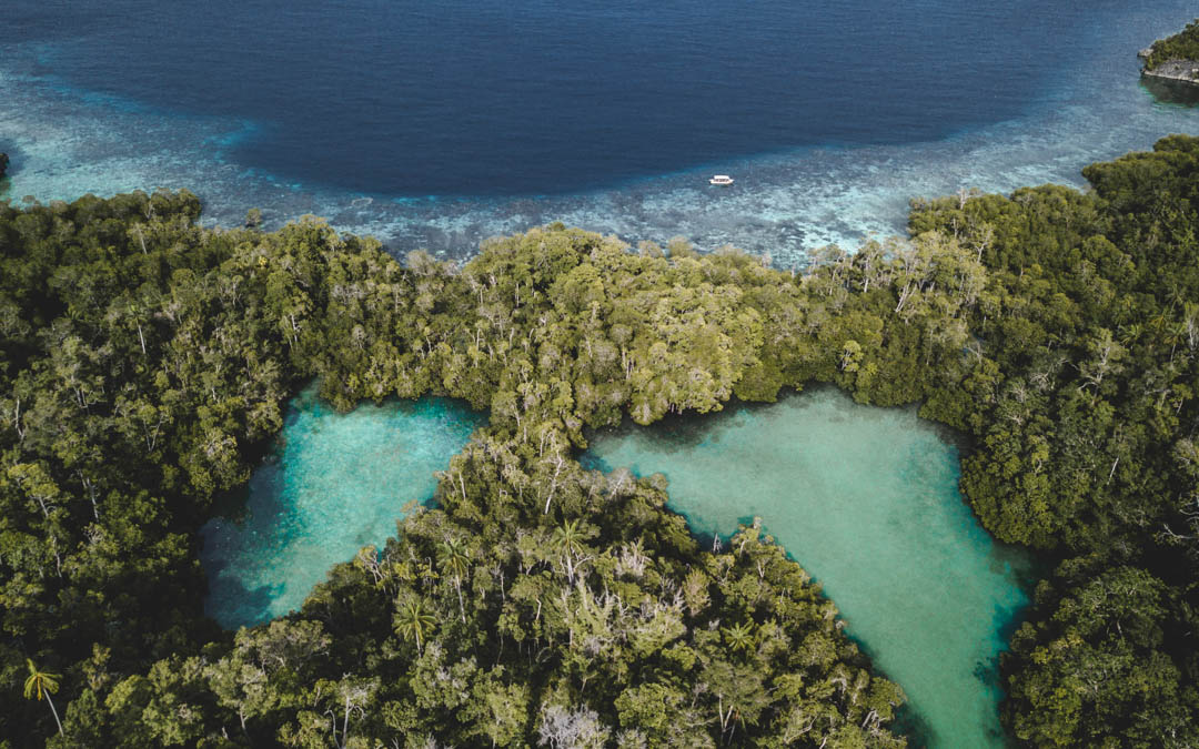 Aerial view of two hidden lagoons on Batanta islands in Raja Ampat